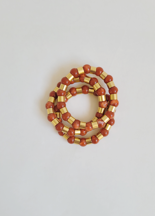 pulseiras coral com dourado