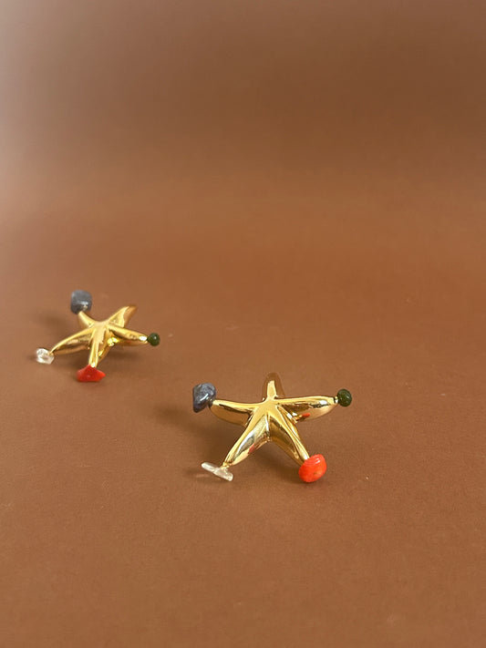 brinco estrela cascalhos