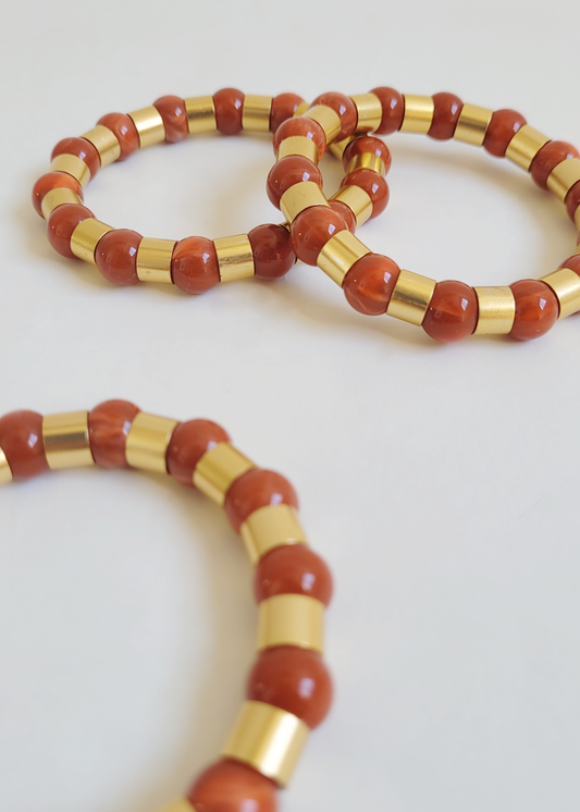pulseiras coral com dourado